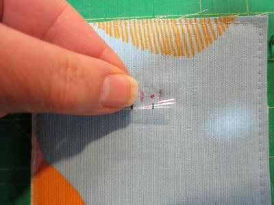 Place the vinly over the fabric