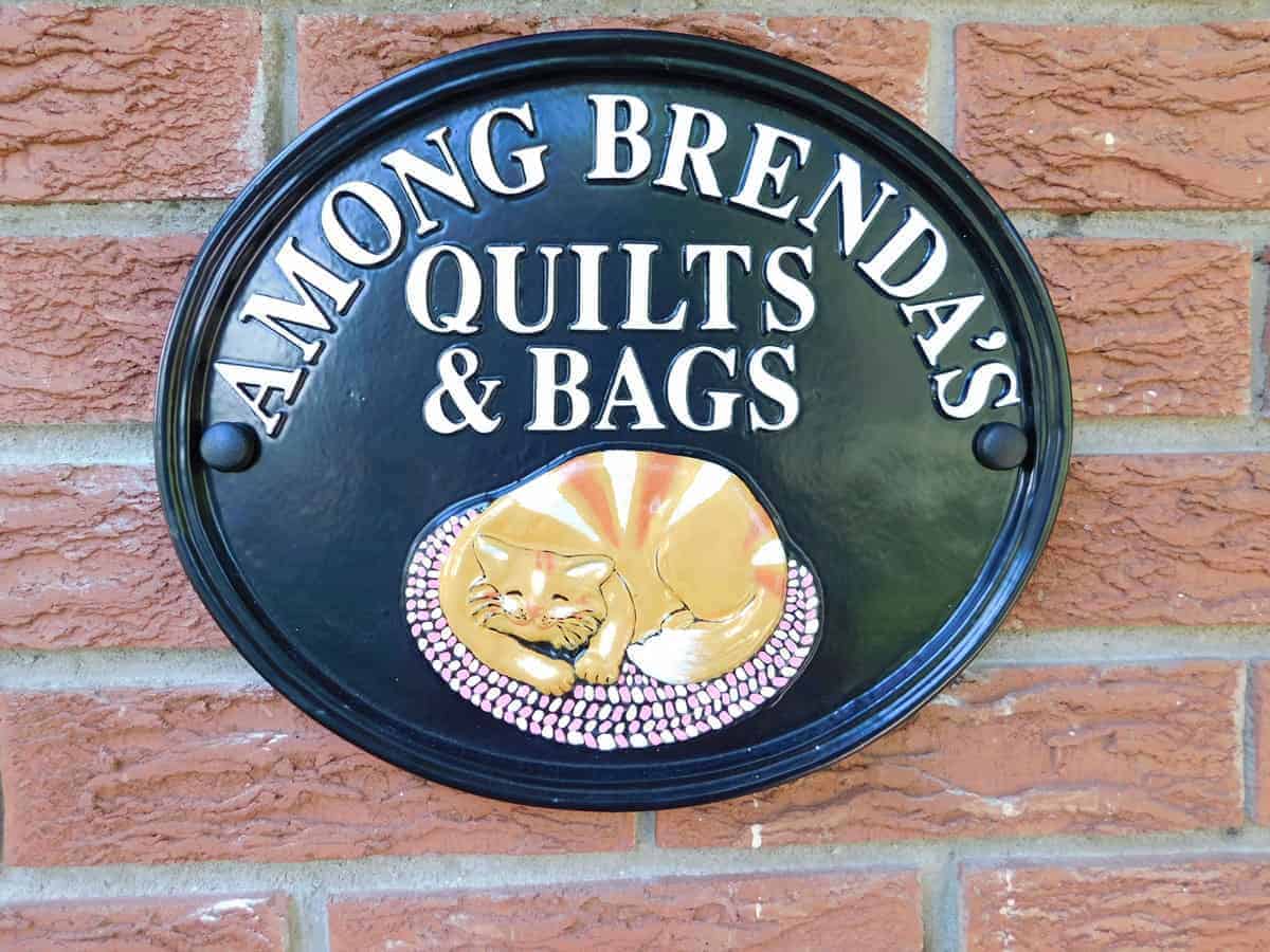 Among Brenda's Quilts & Bags sign