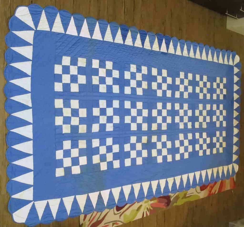 A repaired quilt that was damaged in a tragic fire