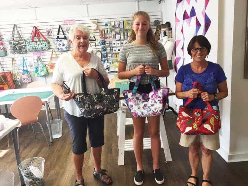 Three newly made Girlfriends Bags with their owners