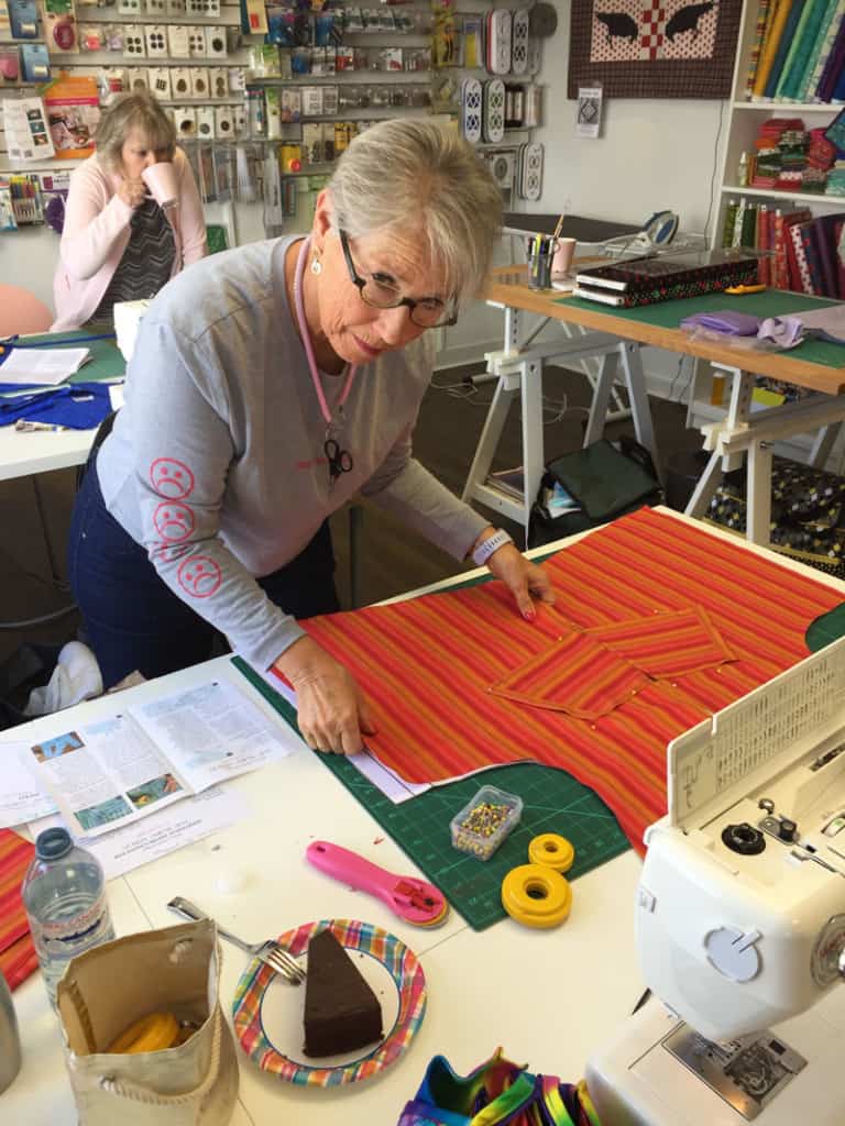 Debbie working on making an apron