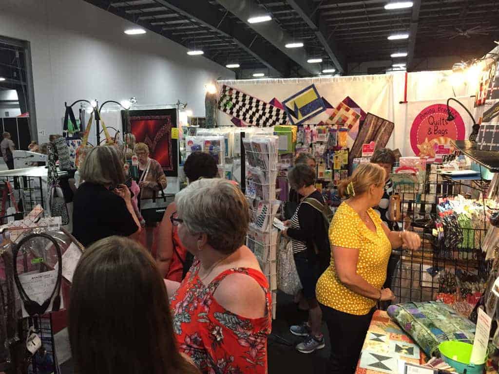 Quilt show attendees at the ABQ booth