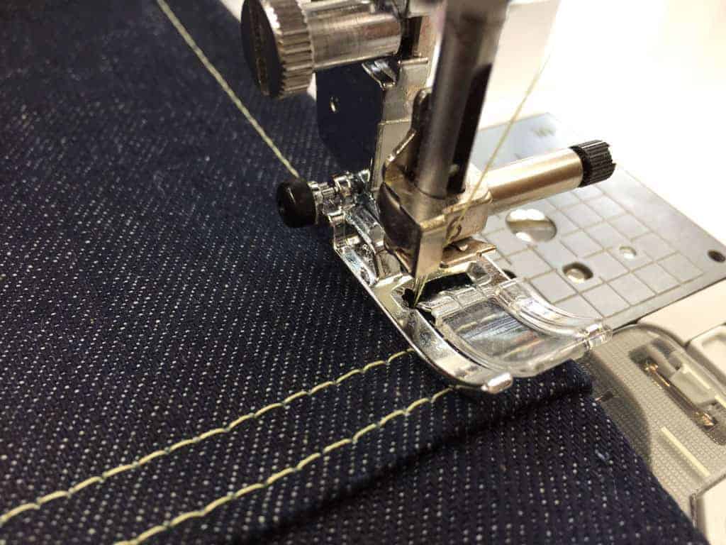 Sewing with heavy fabric demonstration: leveling button is pushed in.
