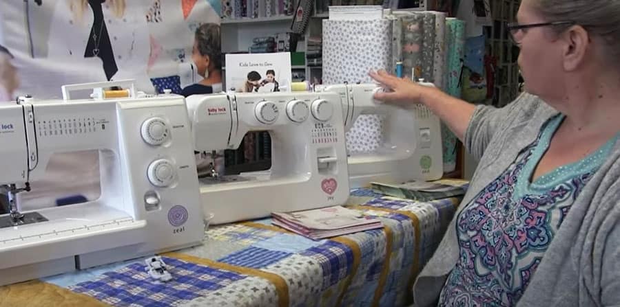 Kelley shows some features on three Baby Lock sewing machines for beginners.