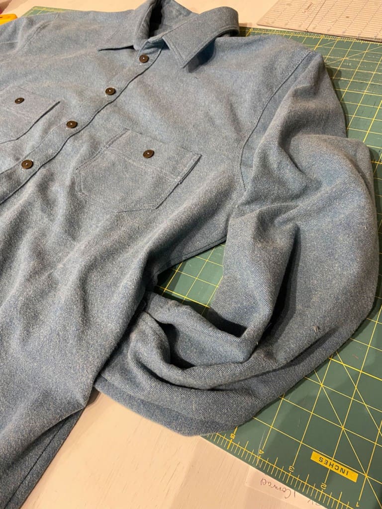 Sleeve tucked into a side pocket in a shirt made for an amputee.