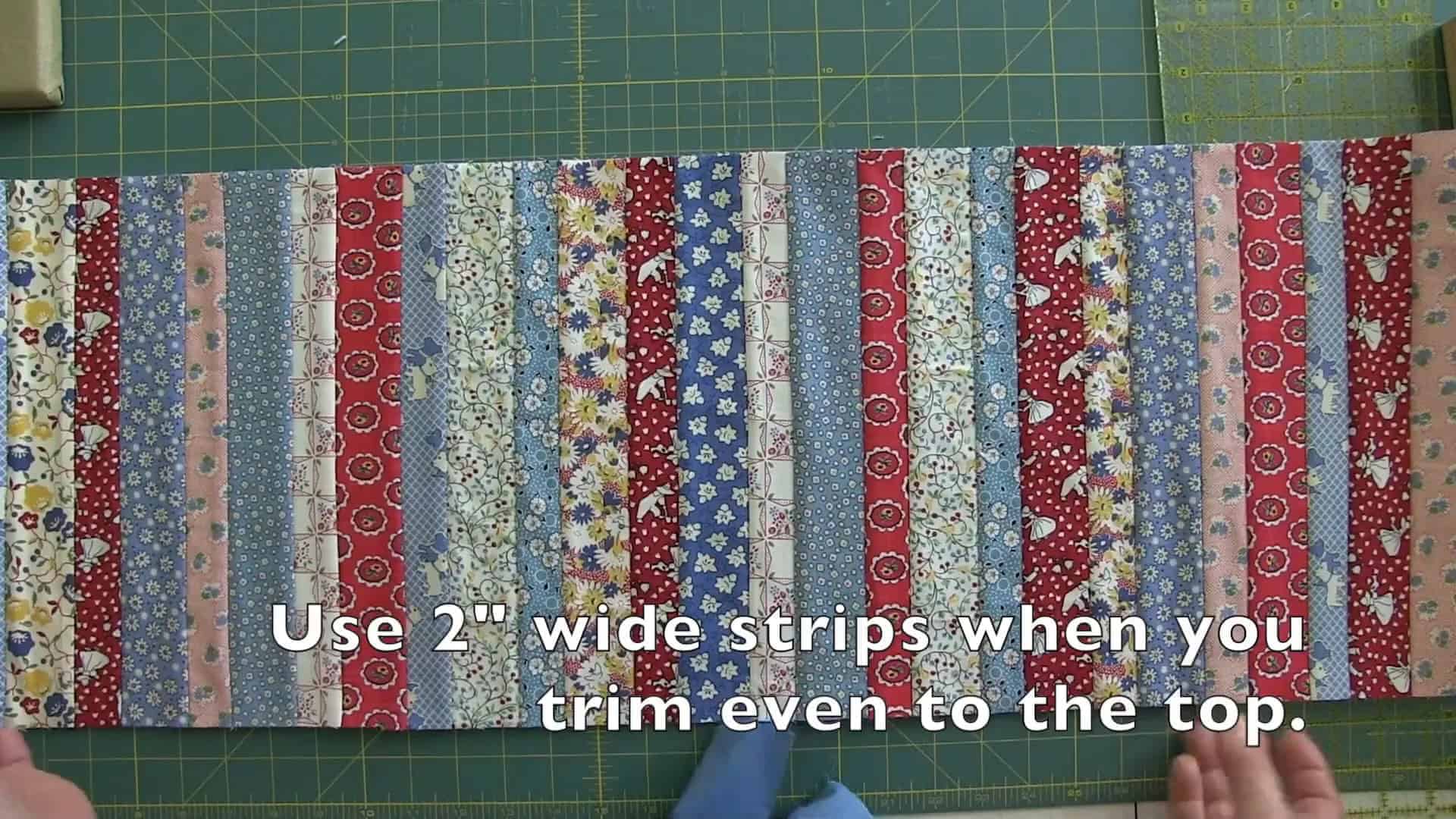 Cutting 2-inch wide fabric strips for binding