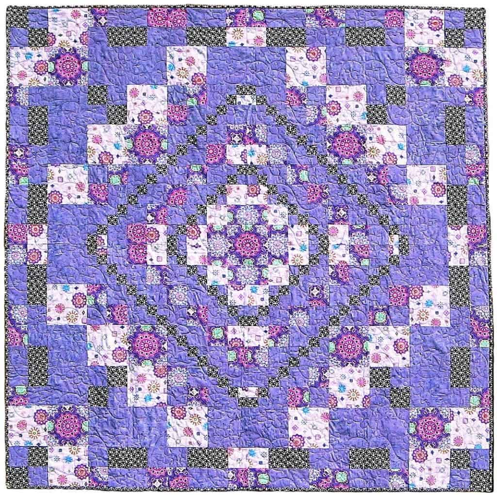 Round Trip quilt in purple fabrics.
